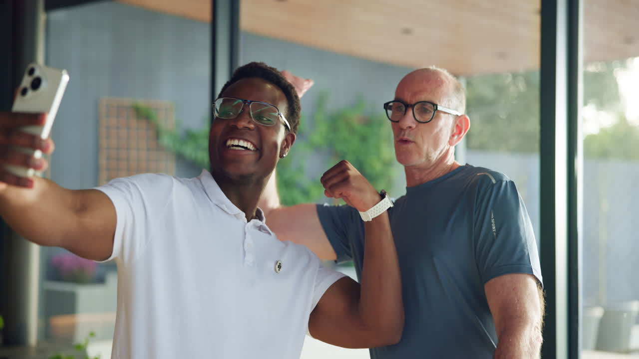 Happy Men Flexing Biceps and Posing for a Selfie Video