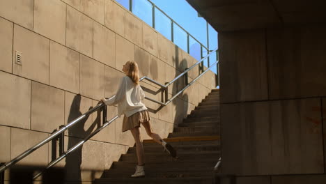 woman posing on city stairs
