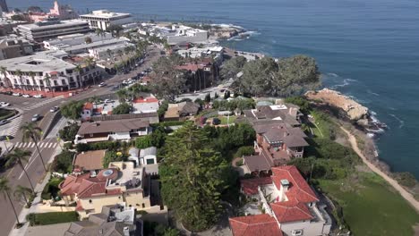 aerial over beachfront neighborhood in la jolla approaching beautiful scenic ocean coast