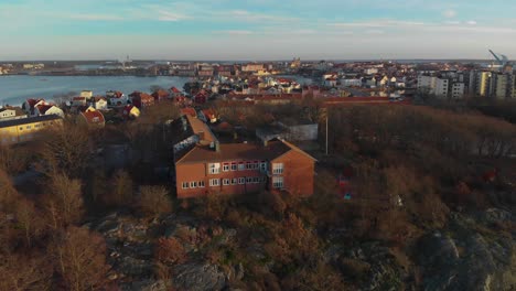 aerial footage over a beach in salto karlskrona, sweden called saltosand also showing a school on the mountain-3