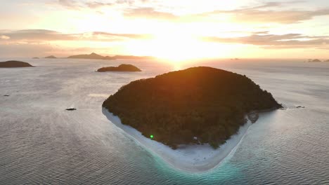 drone hovering over cagdanao island at sunset in philippines