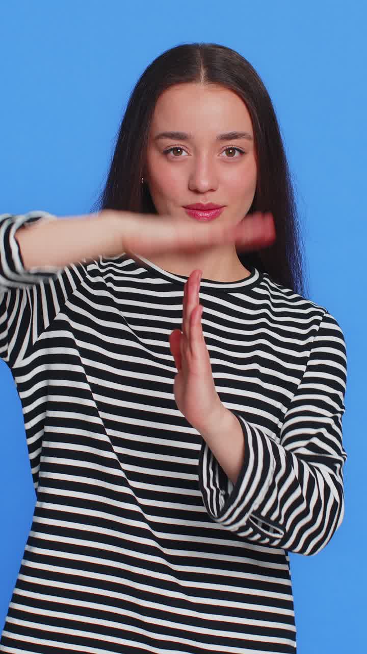 Tired upset young woman showing time out gesture limit or stop sign bored of work take a break