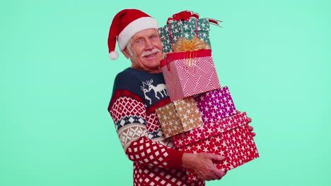 Mature-grandfather-man-in-Christmas-sweater-holding-many-gift-boxes-New-Year-presents-shopping-sale