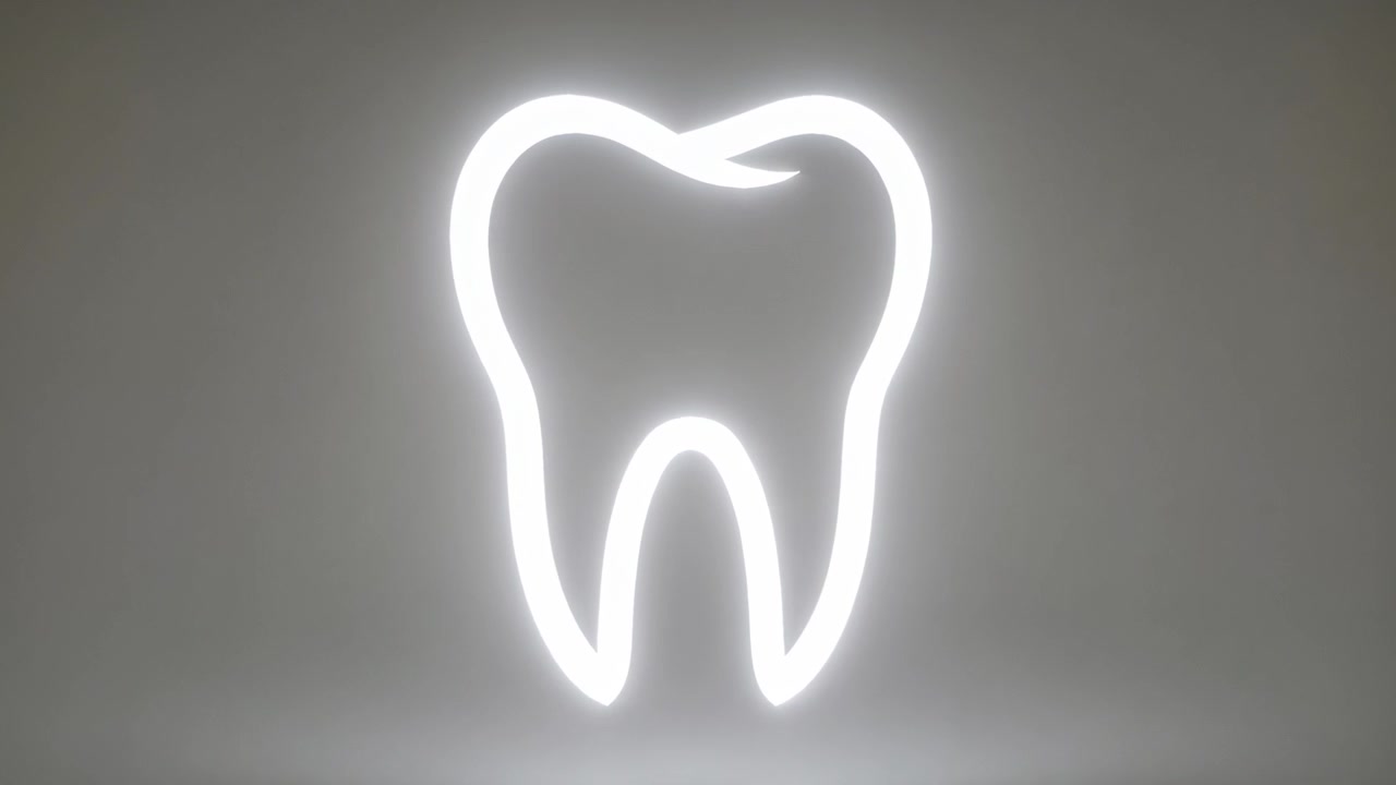 Growing brighter after first frame, neon tooth expanding in pale-gray studio, widening floor glow
