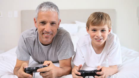 father and son playing video games together