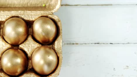 close-up of golden easter eggs in the tray