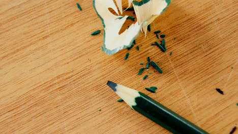 Close-up-of-green-color-pencil-with-pencil-shaving