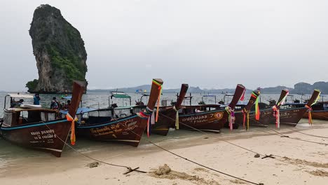 boats anchored on a serene krabi beach