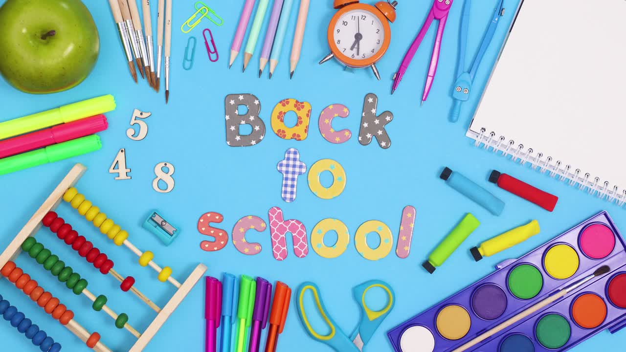 Back to school text move inside of frame made of school stationery. Stop motion