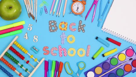 back to school text move inside of frame made of school stationery. stop motion