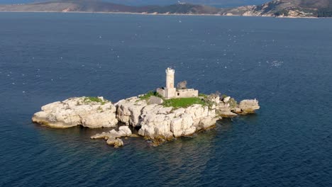 drone beautiful view of lighthouse with seagulls in corfu greece