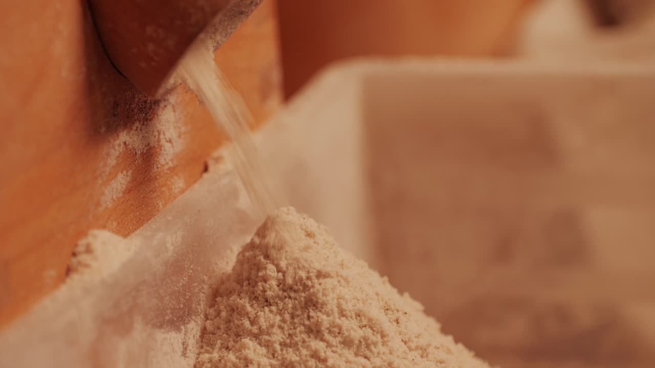 Machinery making flour in wheat flour in bakery or factory, electrical mill machinery. Wheat against diseases and insects using modern equipment. Clip. Concept of food industry. Small business concept . High quality 4k footage