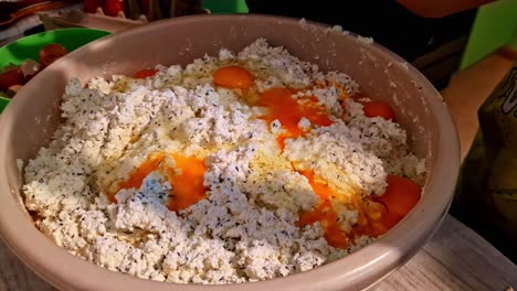 homemade cheese being prepared during the summer solstice in cesis, latvia