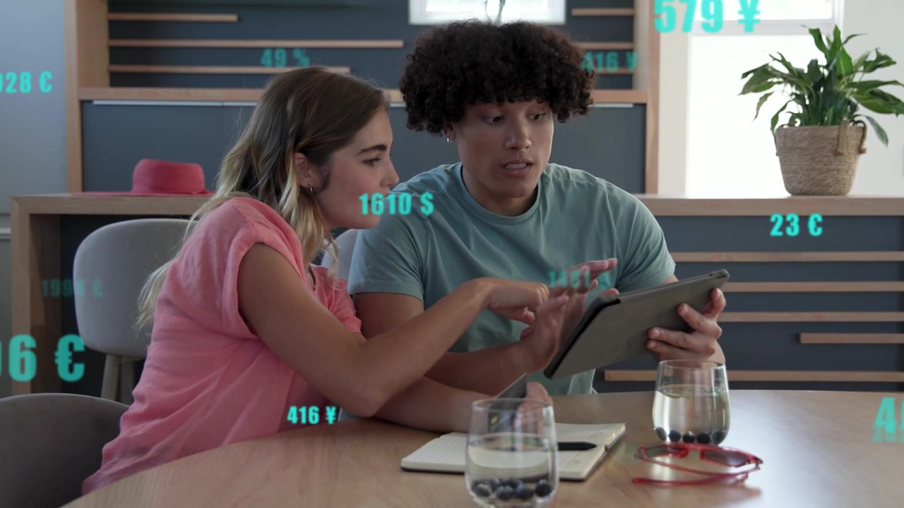 Man holding tablet tapping screen, woman pointing and deciding, turquoise finance overlays flashing