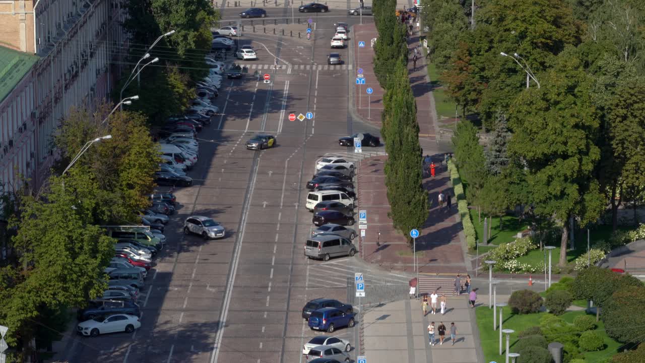 Ukraine,Kyiv,St.Michael Cathedral, footage starts from the wide road that leads to the cathedral than tilts up and shows the whole complex with golden domes and the bell tower surrounded by lush green