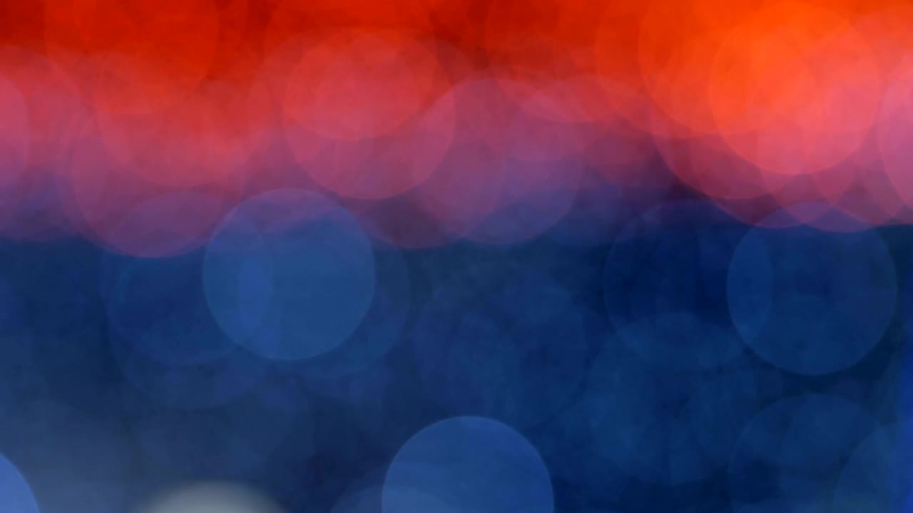 Night abstract background is defocused with nice bokeh. Blurred Christmas Lights Bokeh. Pan across blur .