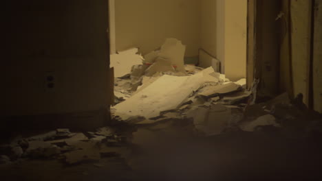 Trashed house from a window in a dark night homelessness