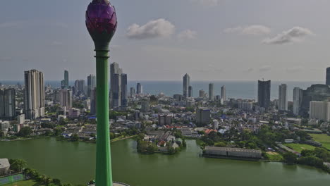 colombo sri lanka aerial v1 drone fly around lotus tower standing at beira lake capturing downtown cityscape across area 02 and wekanda with indian ocean views - shot with mavic 3 cine - april 2023