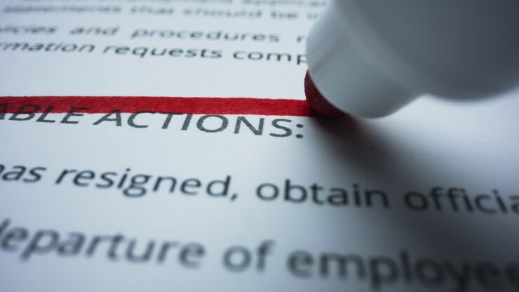 Marker writing straight line on document. Person crossing text on document