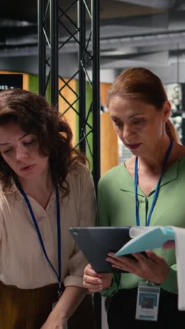 vertical video strong diverse team of women works together on project analysis