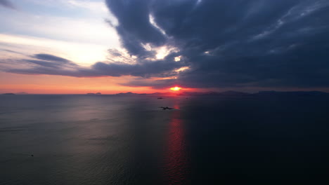 dramatic sunset over the ocean with islands