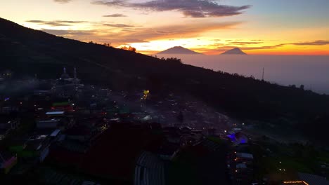 Aerial-view-of-Nepal-Van-Java-village-with-orange-sky-of-sunrise-in-slightly-foggy-weather