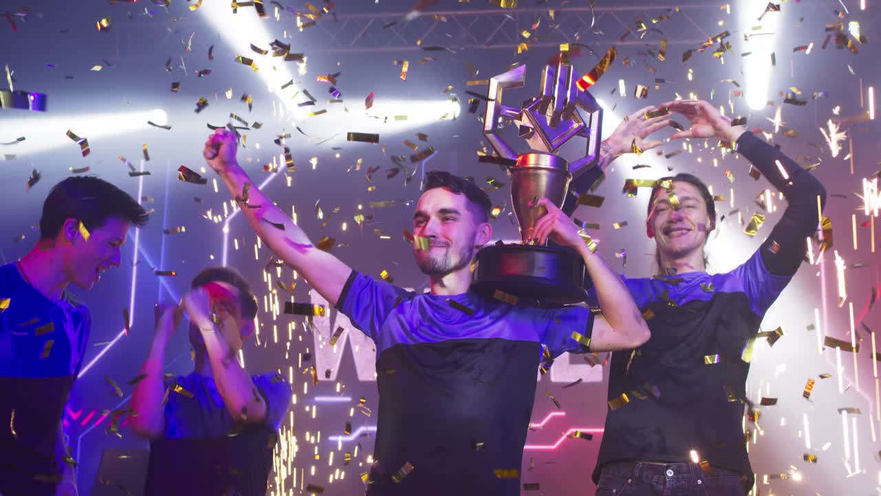 Team of gamers celebrating victory in professional championship