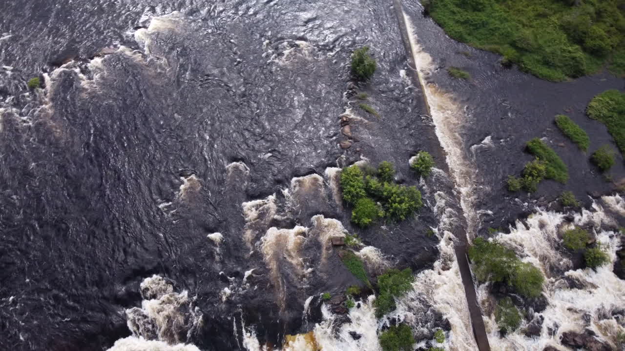 Zenith aerial view moving rightward slowly over the Caroní River rapids.