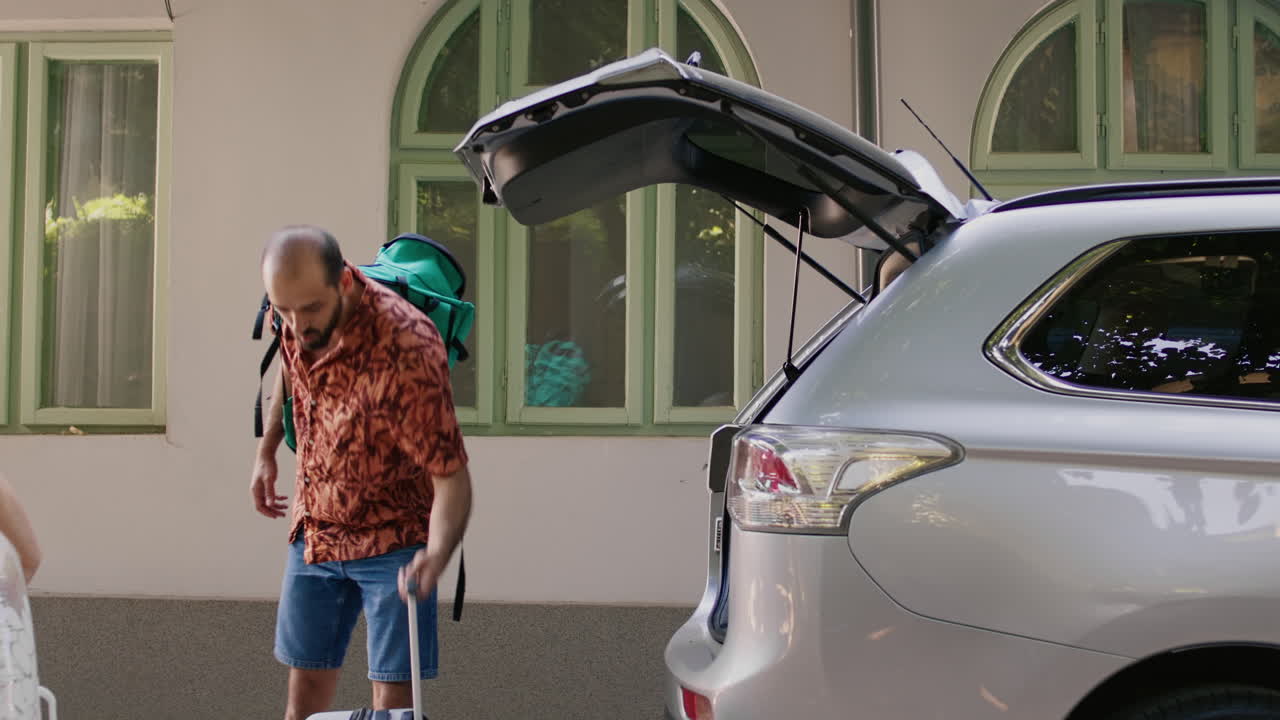 Couple Packing Car for Vacation