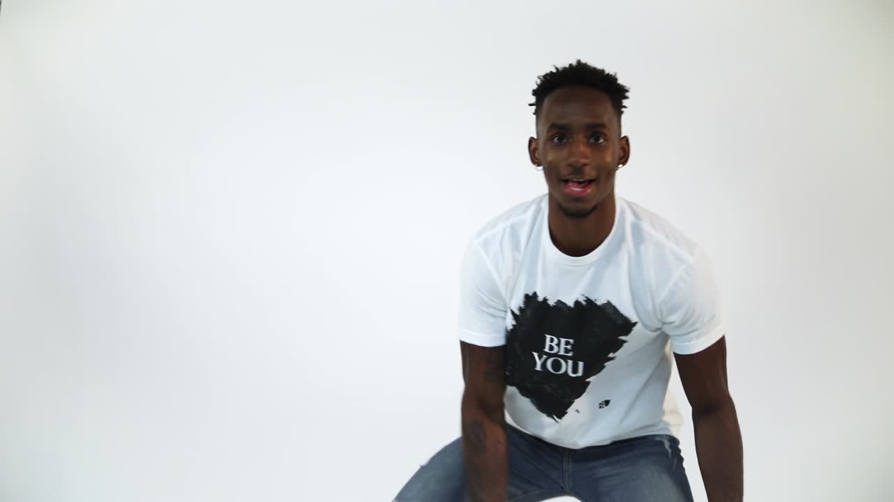 Slow Motion shot of an African American dribbling a basketball