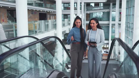 escalator, office and business women on tablet