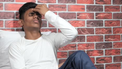 teenager with head in hands