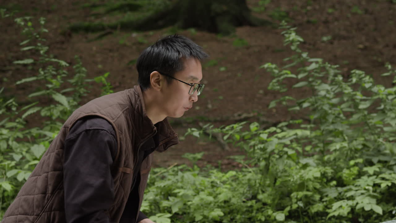 Man in the woods with a car