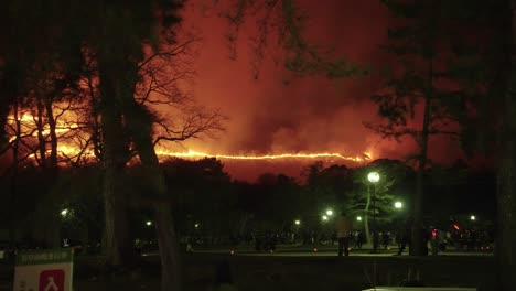 mountain burning in distance of nara, japan