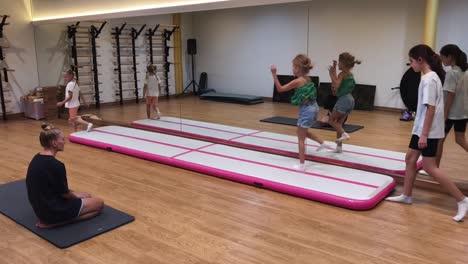 kids gymnastics class on air track