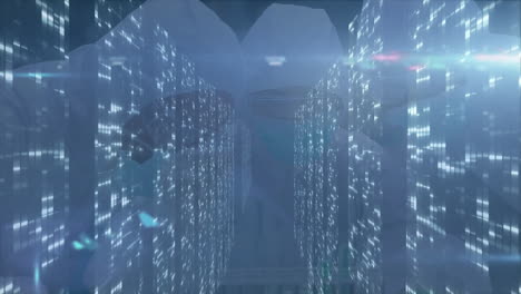 Server racks guiding view down data center aisle, with data overlays floating over LED lights