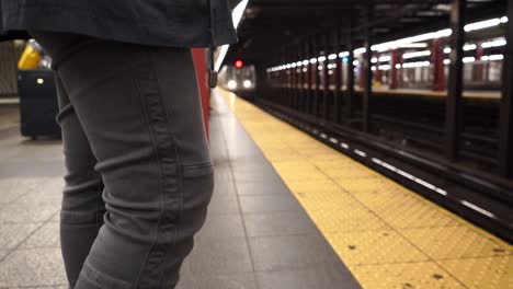 girl prepares to enter subway train