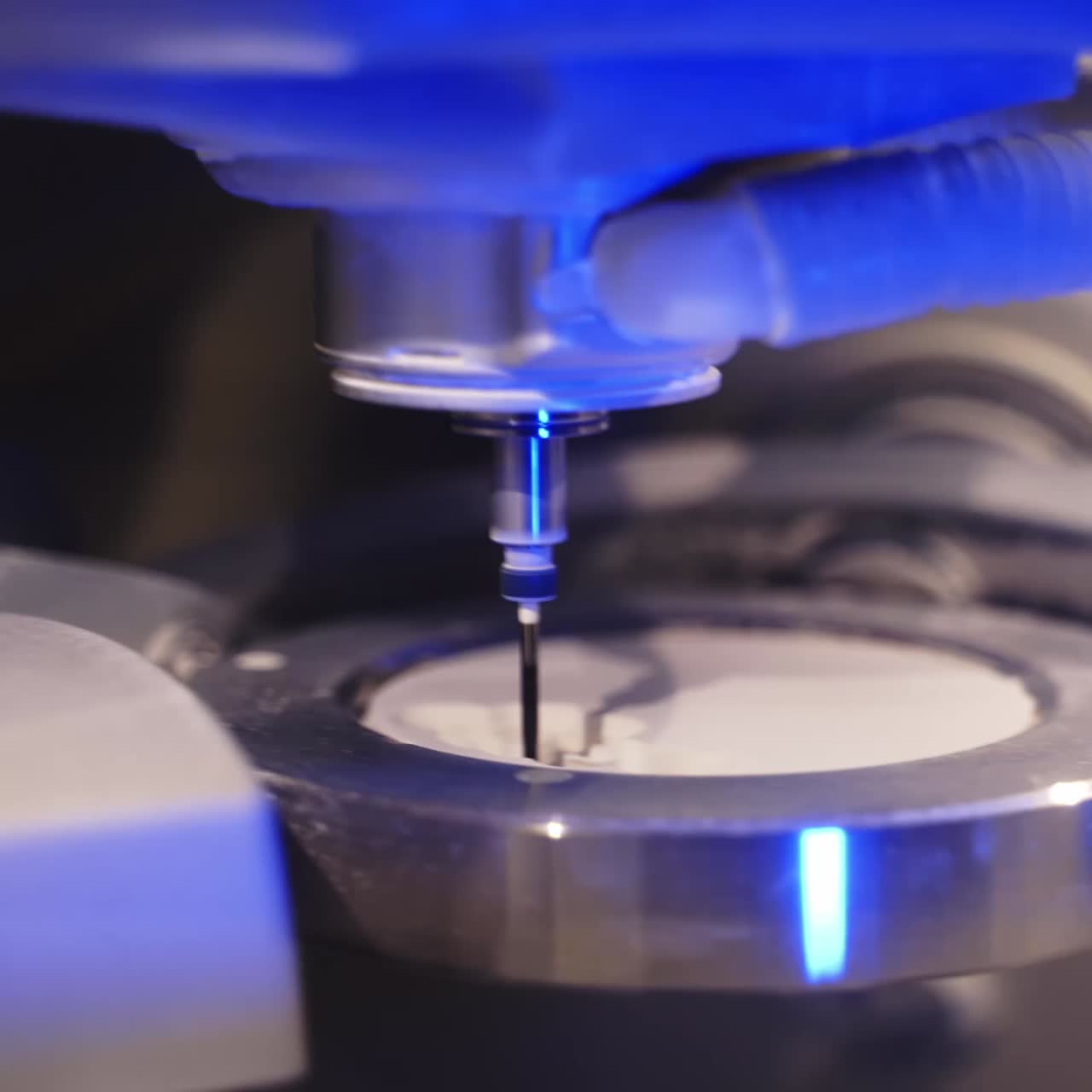 Advanced technology in dentistry. Work of the dental milling machine processing of carving out shape of human teeth. Close-up