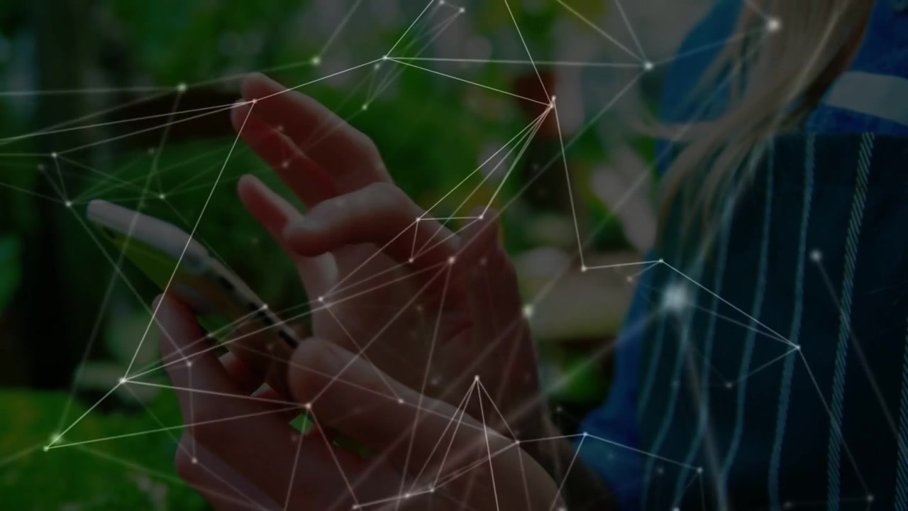 Tapping woman's hands manipulating phone inside plant shop, with network overlay and striped shirt