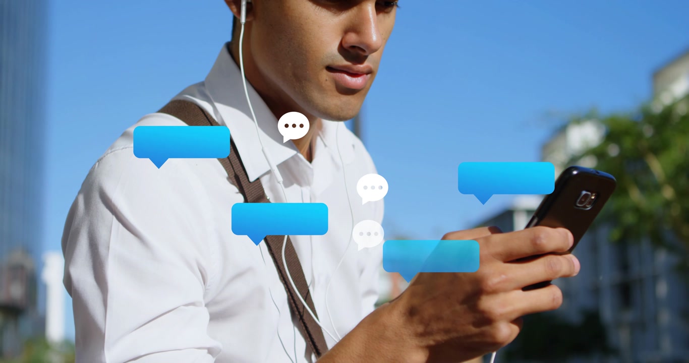 Man standing on street scrolling phone, causing blue bubbles growing around phone, showing messages