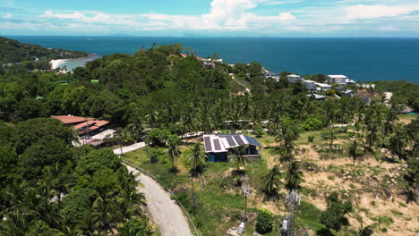 Solar-roof-panels-on-a-house-in-thailand,-aerial-view