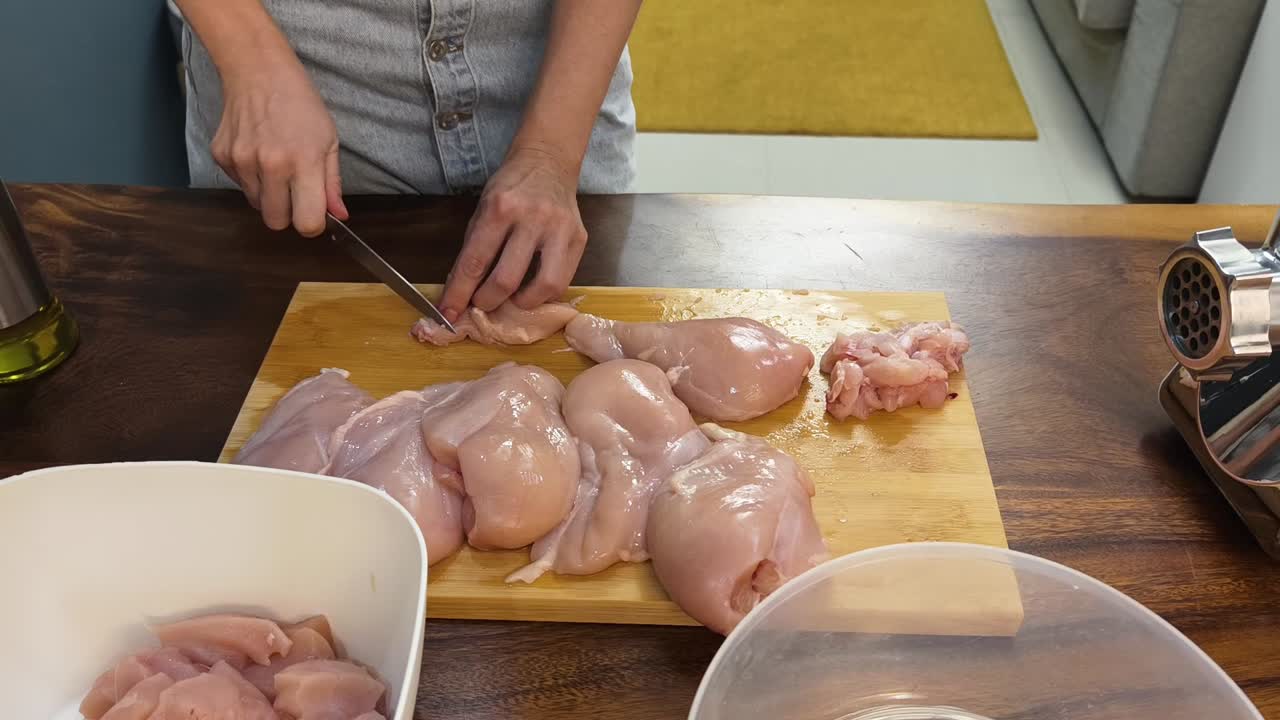 Cutting Chicken on a Cutting Board