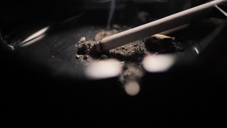 close up smoking cigarette on man hand