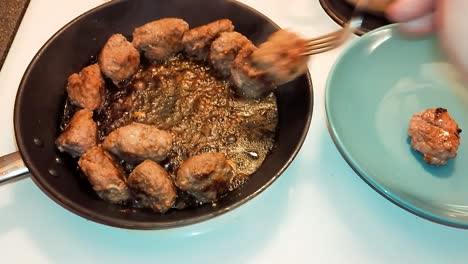 fried meatballs frying pan