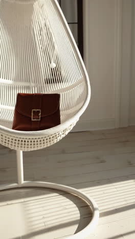 elegant brown leather bag in a sunny minimalist interior