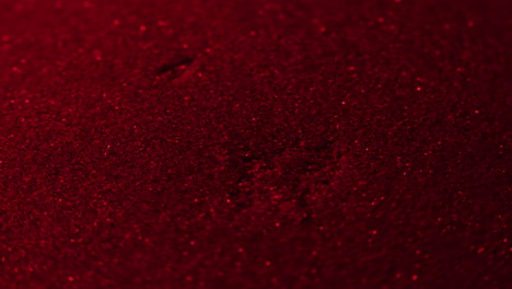 close-up view of a deep red textured surface