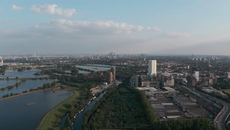 Descending-drone-shot-of-London-city-skyline-from-Tottenham-Hale-Walthamstow-reservoirs