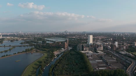 descending drone shot of london city skyline from tottenham hale walthamstow reservoirs