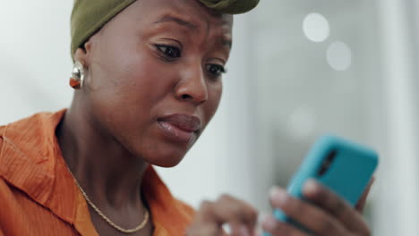 black woman with smartphone, crying and sad