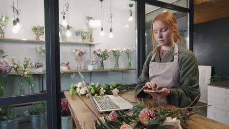 florist using smartphone at work